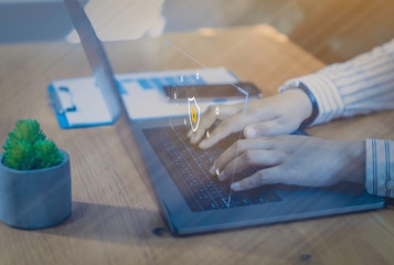 Businessman using a laptop computer with technology cybersecurity and privacy concept. protection and safe data for global network security.