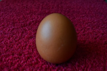 Eggs are laid on a red cloth.