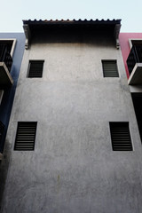 details of a modern loft construction of houses and clean blue sky, contrast of buildings.