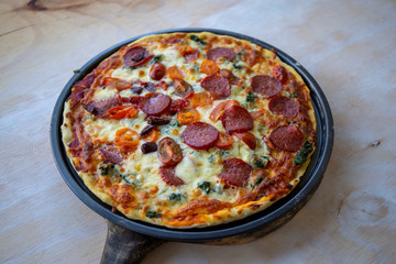 Chorizo, tomato and mozzarella cheese pizza