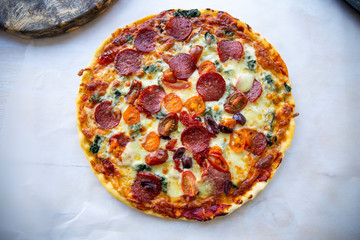 Chorizo, tomato and mozzarella cheese pizza