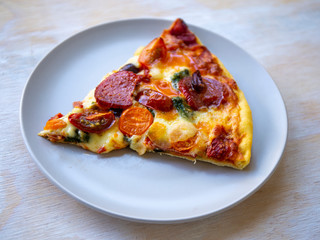 One piece of Chorizo, tomato and mozzarella cheese pizza
