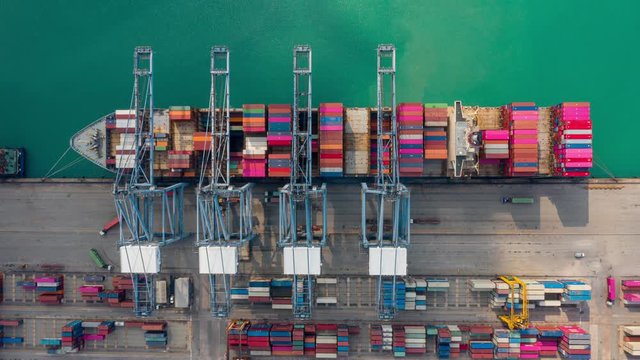 Container ships loading and unloading in Hutchison Ports, Business logistic import-export transport sea freight and transportation of containers in port, Shipping container buildings, Aerial top view 