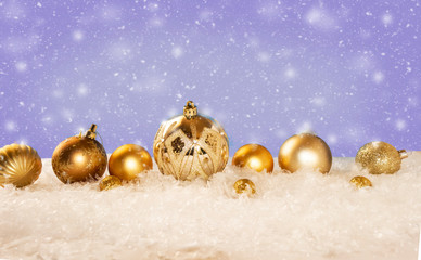 Gold Ornaments Lined on snowy background