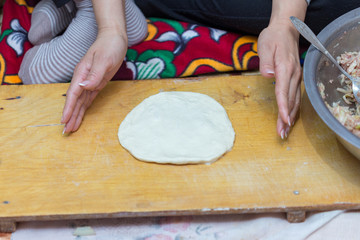 woman prepares soft, juicy korean manti
