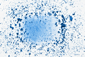 Classic blue eyeshadow powder swatch smear smudge. Trendy color makeup background