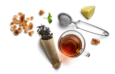Black tea and accessories top view on white background