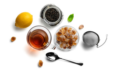 Black tea and accessories top view on white background