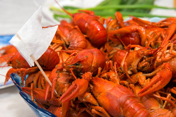 Crayfish boiled on a plate show a white flag