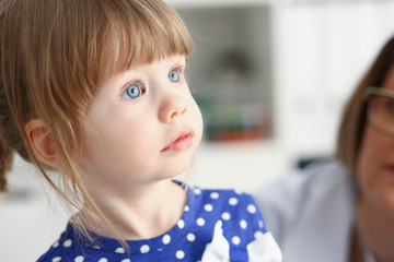 Little child with mother at pediatrician reception