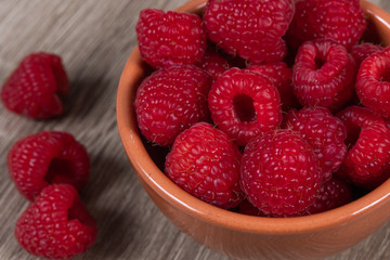 dish of fresh raspberries on a table