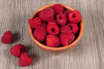 dish of fresh raspberries on a table