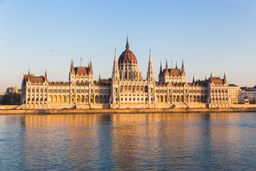 Fototapeta na wymiar Budapest parliament building during sunset with reflection in Danube river