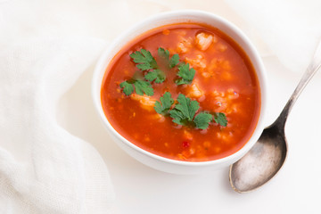 Tomato soup with rice decorated with parsley
