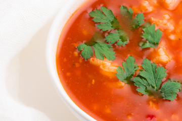 Tomato soup with rice decorated with parsley