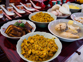 Asian Chinese ancestor worship - food offerings made to ancestors on Dongzhi / Winter solstice