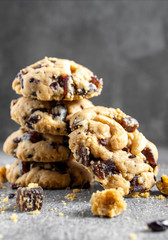Stack of tasty chocolate cookies on gray table