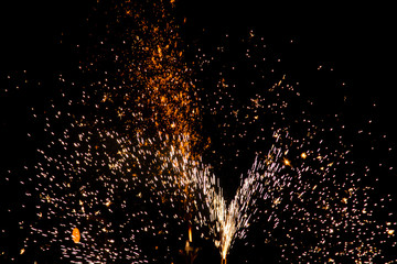 Fototapeta na wymiar fireworks sparks on black background