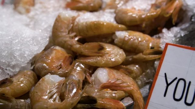 Pile of shrimp set on ice at the fish market.