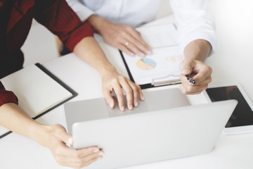 Business executive calculating a sales data perform spreadsheets.