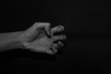 Fototapeta premium Monochrome hand gestures on black background
