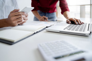 Team of Business people discussing a project of financial plan for marketing.