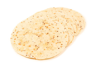 Pitta bread with seeds isolated on white