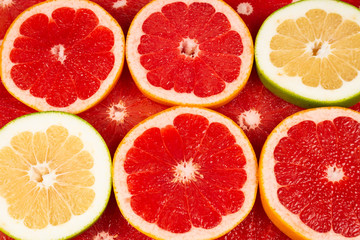 Fototapeta na wymiar Pomelo and grapefruit slices background.