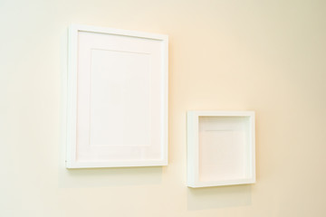 Empty photo frame on wall decoration interior