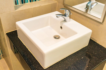 Water facuet and white sink decoration interior