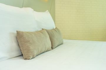 White comfortable pillow on bed decoration interior