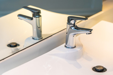 Water facuet and white sink decoration interior