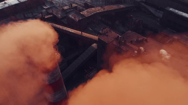 Aerial view pf industrial smokestack. Emission to atmosphere from industrial pipes, air pollution concept. Smokestack pipes shooted with drone.