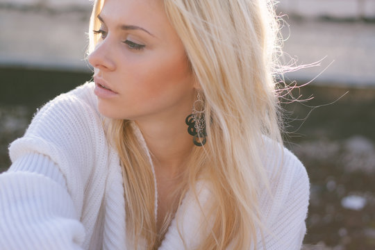 Girl in sweater close-up portrait outdoor. Warm fall.