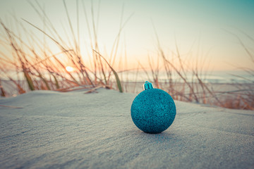 Christmas and New Year ball, toys and decorations on the beach