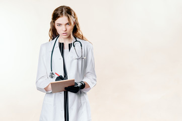 Girl doctor blond young light background studio day beautiful one positive tablet looking smiling concept of remote customer care online patients.