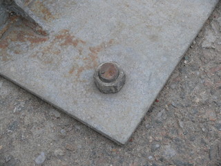 fastening by nut and bolt.