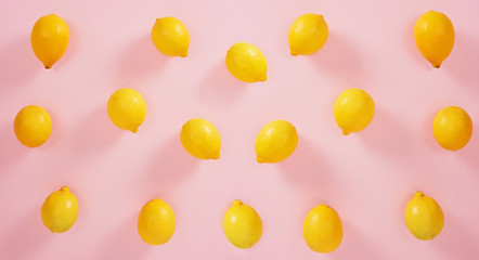 Lemons isolated on pink background. High Angle View Of Lemons. Free space for text.