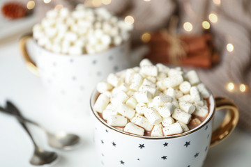 Delicious cocoa drink with marshmallows on table, closeup