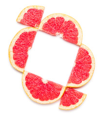 Composition with fresh cut grapefruit on white background