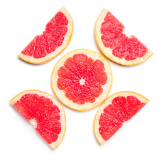 Fresh cut grapefruit on white background