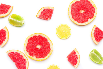 Fresh cut grapefruit, lemon and lime on white background