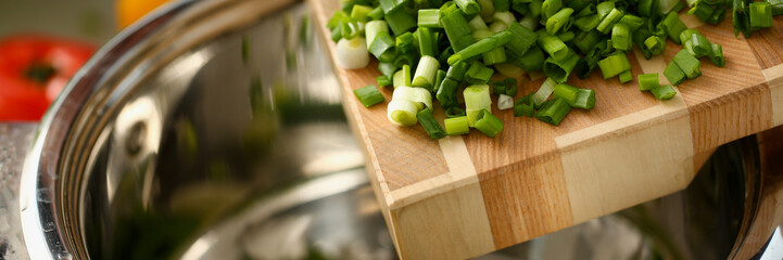 Cook holds knife in hand and cuts on