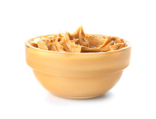 Tasty peanut butter in bowl on white background