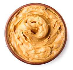 Tasty peanut butter in bowl on white background