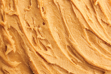 Tasty peanut butter as background