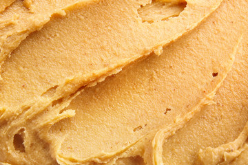 Tasty peanut butter as background