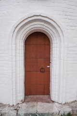 Fototapeta na wymiar Old iron door of the cathedral. Door in the church