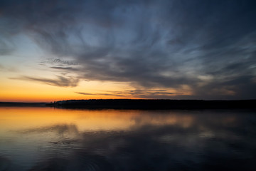 Fototapeta premium Natural photo background. Blur sunset over the lake 