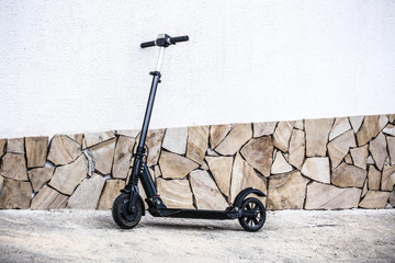 Modern electric kick scooter outdoors © Pixel-Shot